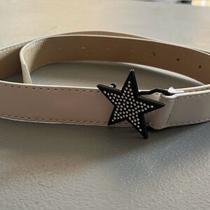 White belt with black bedazzled star buckle